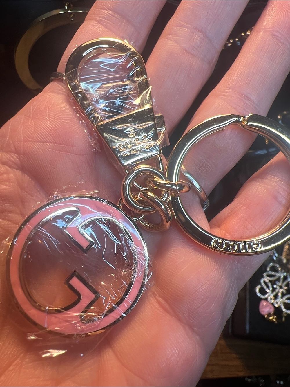 Gold-Tone Keyring with Pink Enamel Logo Charm